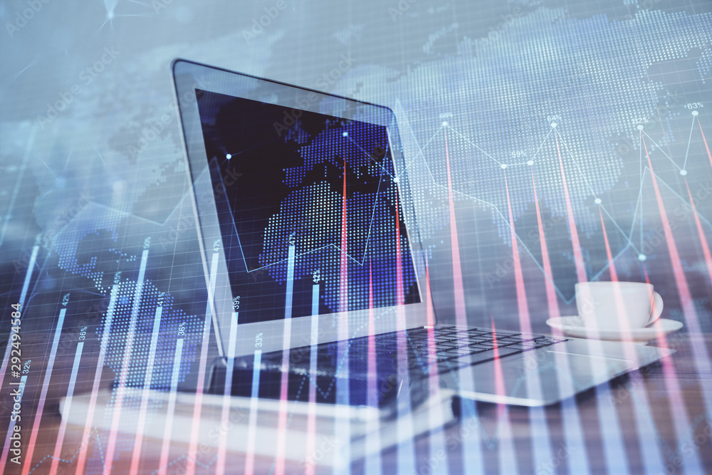 Forex market chart hologram and personal computer background. Multi exposure. Concept of investment. Forex market chart hologram and personal computer background. Multi exposure. Concept of investment.