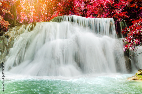 Fototapeta Naklejka Na Ścianę i Meble -  Travel to the beautiful waterfall in tropical rain forest, soft water of the stream in the natural park at Huai Mae Khamin Waterfall in Kanchanaburi, Thailand.
