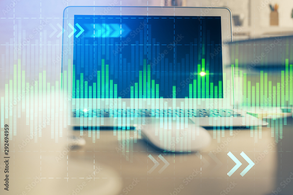 Forex Chart hologram on table with computer background. Double exposure. Concept of financial markets. Forex Chart hologram on table with computer background. Double exposure. Concept of financial markets.
