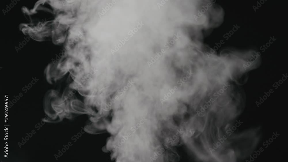 Slow motion water mist puff stream over black background