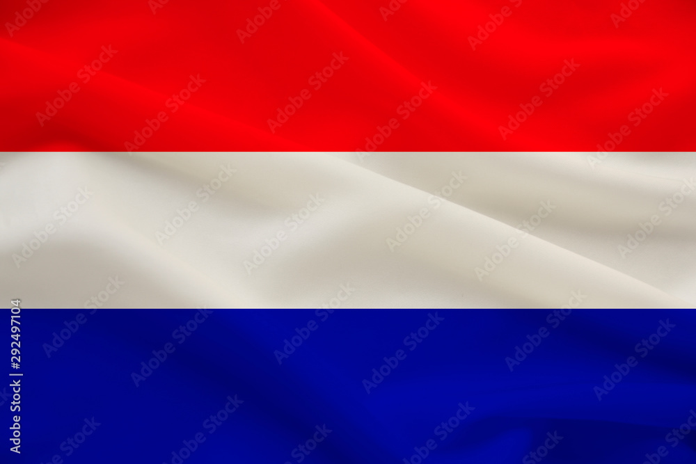 national flag of the country Holland on gentle silk with wind folds, travel concept, immigration, politics, copy space, close-up national flag of the country Holland on gentle silk with wind folds, travel concept, immigration, politics, copy space, close-up