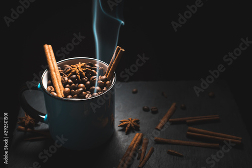 cup of coffee beans on dark background