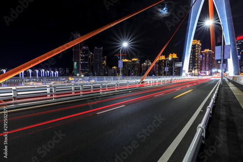 Urban road and bridge buildings pass through the financial district in Chongqing at night China.