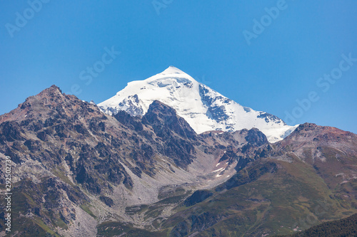 Mount Tetnuldi rises above the Great Caucasian Range in the upper Svaneti in Georgia, Mountain Landscape. © k_samurkas