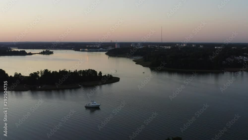 Aerial, orbit, drone shot, around a boat, between islands and the coast of Soukansalmi, at dusk, on a sunny, autumn evening, in Espoo, Uusimaa, Finland
Aerial, orbit, drone shot, around a boat, between islands and the coast of Soukansalmi, at dusk, on a sunny, autumn evening, in Espoo, Uusimaa, Finland