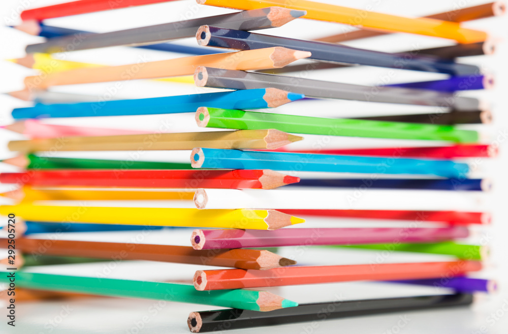pencils stacked in log house