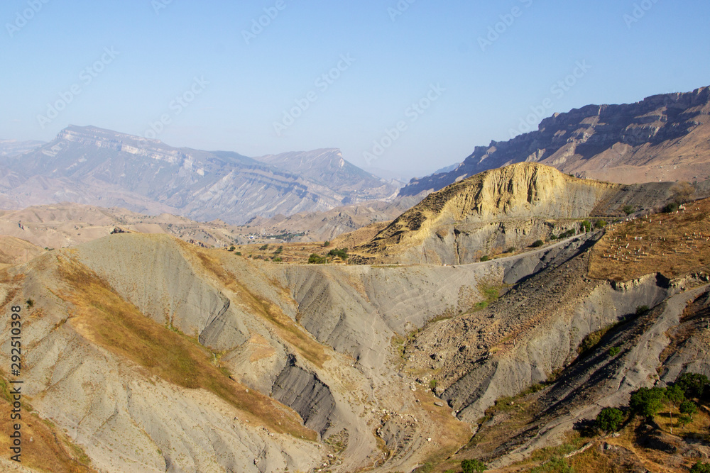 mountain lake in the valley in the distance against the backdrop of peaks, Russian, Dagestan