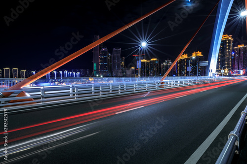Urban road and bridge buildings pass through the financial district in Chongqing at night,China.