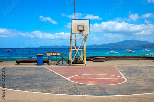 Basketball backboard on seaside landscape. Basketball playground on seashore. Outdoor sport in the Philippines.
