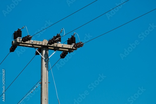 Electric poles and blue sky