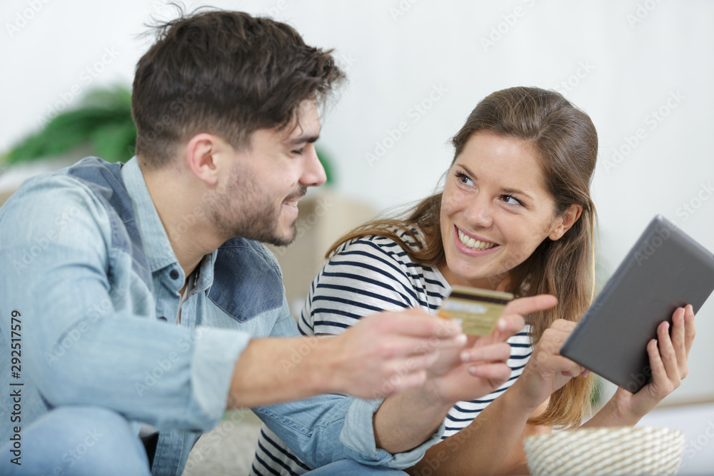 couple shopping from home with a credit card