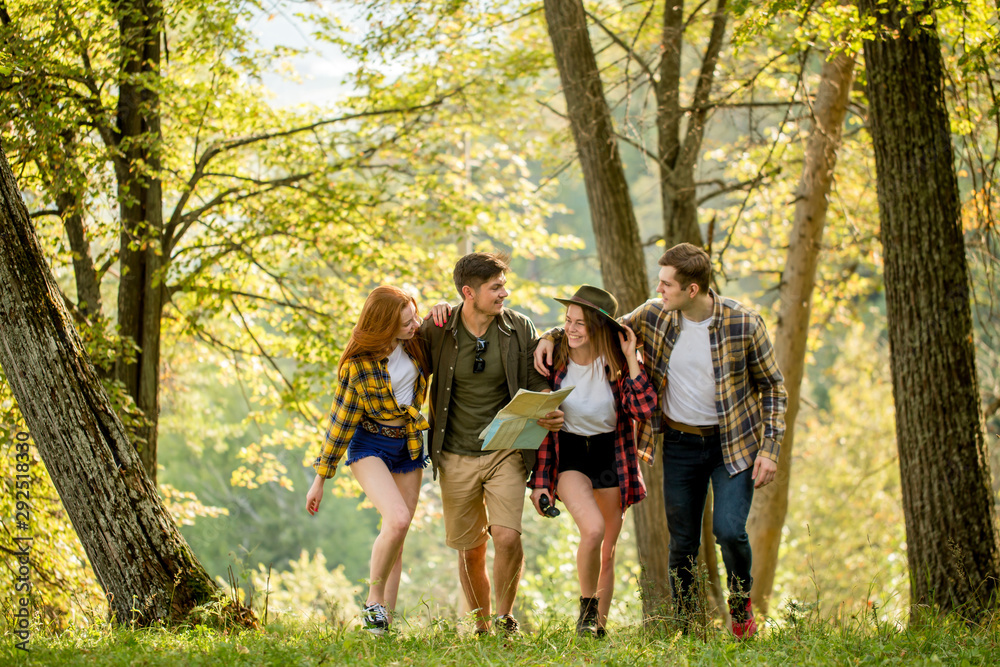 four close friends taklking, walking outdoors, friendship, leisure, pastime close up photo