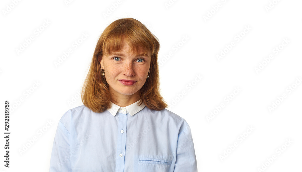 Close up portrait of young beautiful redhead girl in white shirt smiling looking at camera. Copy space. Isolated on white background. Close up portrait of young beautiful redhead girl in white shirt smiling looking at camera. Copy space. Isolated on white background.