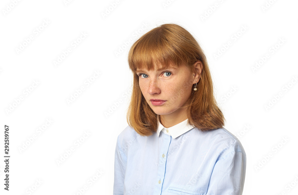 Close up portrait of young beautiful redhead girl in white shirt smiling looking at camera. Copy space. Isolated on white background. Close up portrait of young beautiful redhead girl in white shirt smiling looking at camera. Copy space. Isolated on white background.