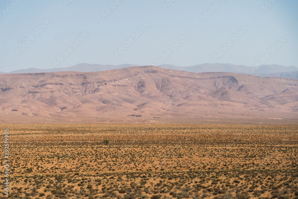Beautiful scenic panoramic view of the canyons and plain fields in Morocco close to the Sahara Desert