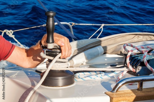 Sailboat Winch and Rope Yacht detail. Yachting. Sailing on the sea. Close Up on yacht cord crank, yachting sport, sailboat detail, summer vacation concept