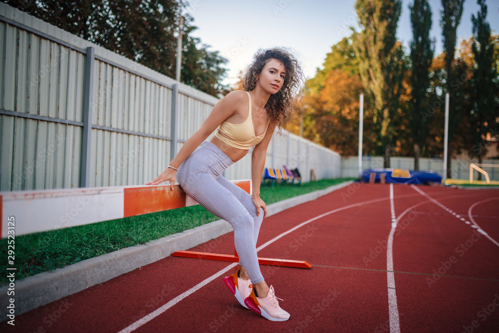 sports beautiful girl at the stadium go in for sports sports beautiful girl at the stadium go in for sports