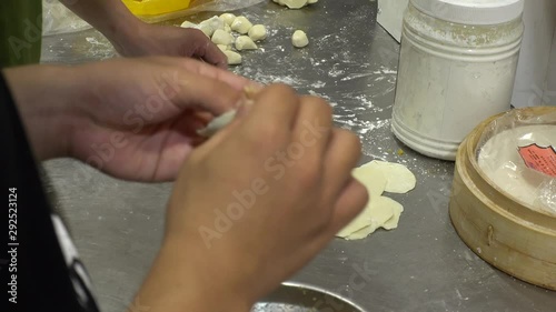 View of cooking Chinese food, “Xiaolongbao”. It is a type of Chinese steamed bun. Also known as dumplings, mantou and dim sum. photo