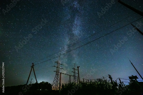 Starry sky and the milky way over the power lines.