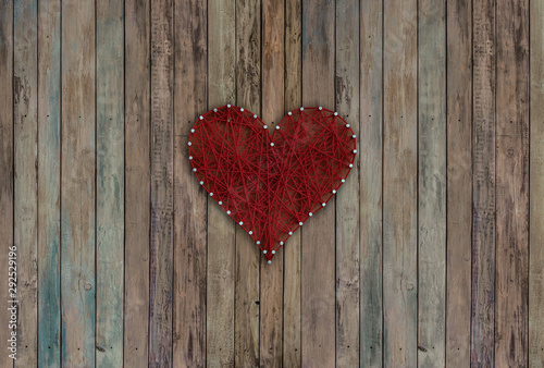 red heart on wooden board