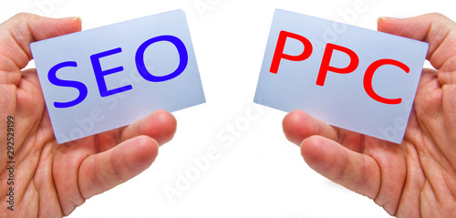 SEO versus PPC - Search Engine Optimization vs Pay Per Click. Concept for marketing, social network  