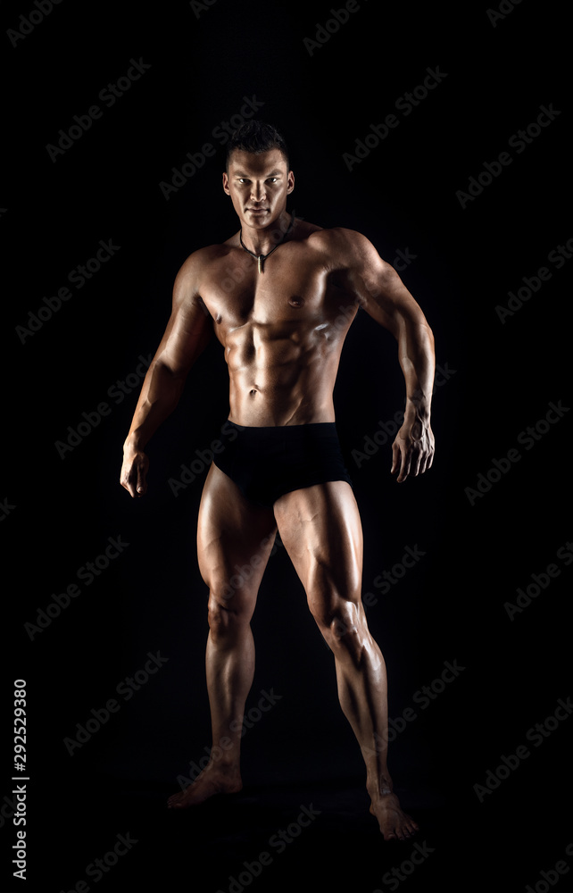 portrait muscular man on black background