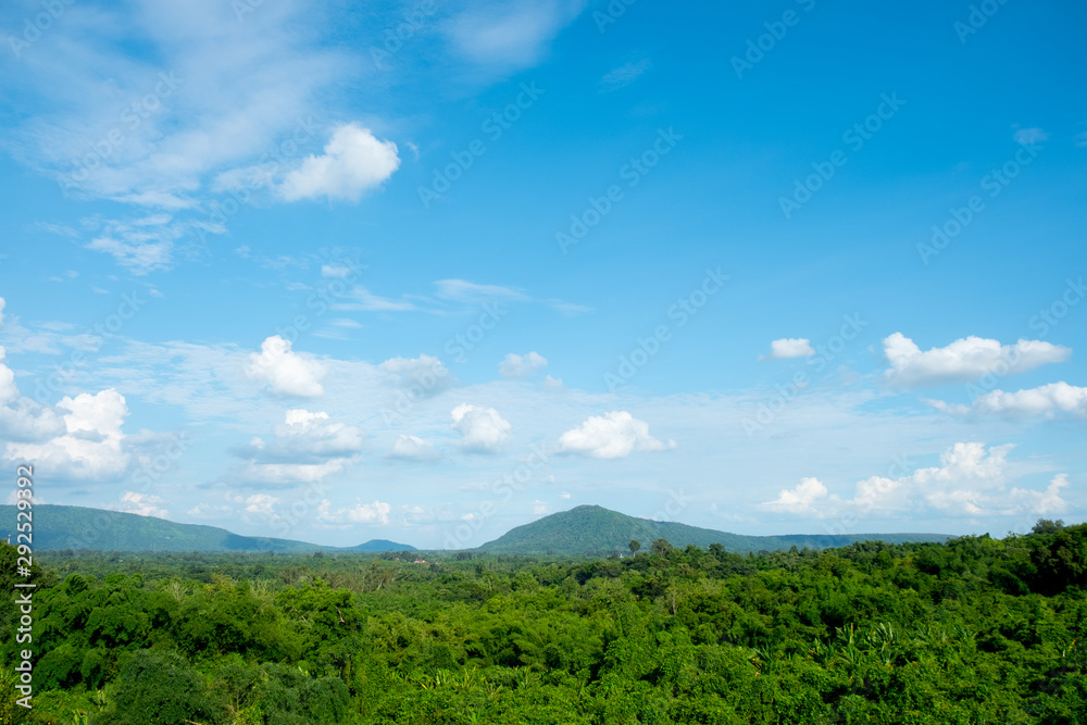 Mountains covered forest, trees and blue sky with clouds. Mountains covered forest, trees and blue sky with clouds.