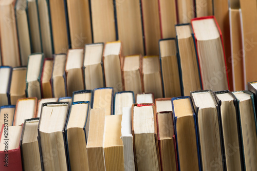 Stack of books background. many books piles.