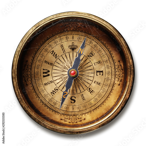 Vintage brass compass isolated on white background photo