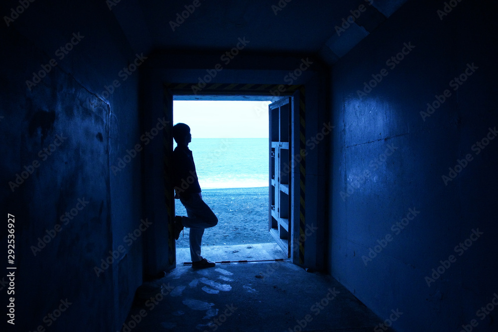 Seaside cave and silhouette