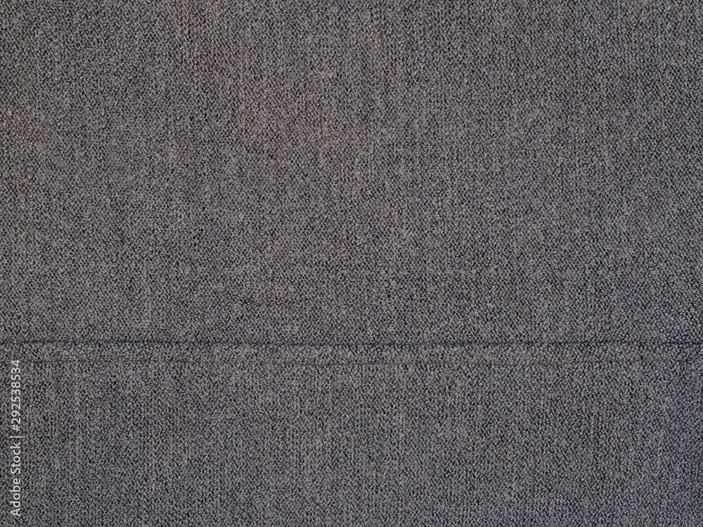 Fototapeta premium Gray woolen texture fabric. Cashmere. Solid background.