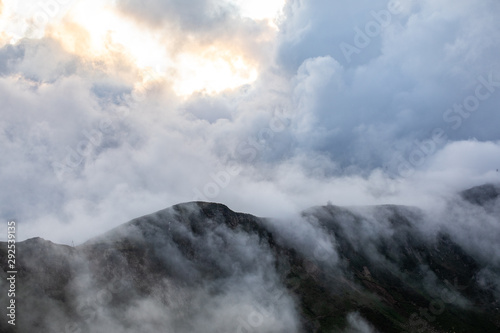 landscape with peaks covered by clouds. mountains 