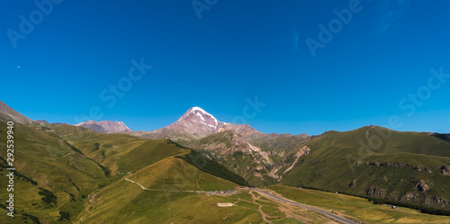 Caucasus Mountains on the border of Russia and Georgia. Very beautiful view of the Mount Kazbek, the second highest peak in Georgia with background of cloud.