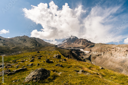 Caucasus Mountains on the border of Russia and Georgia. Very beautiful view of the Mount Kazbek, the second highest peak in Georgia with background of cloud.