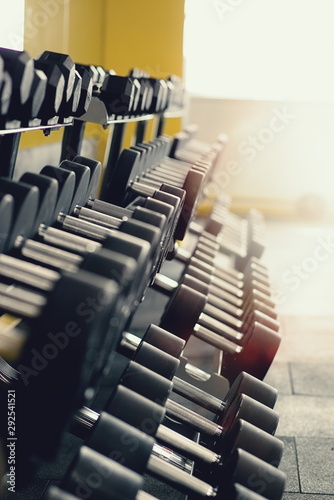 dumbbells of different weights in the gym photo