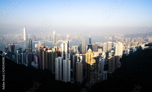 View from above, stunning view of the Hong Kong skyline during a beautiful sunset. Picture taken from the Victoria Peak. Victoria Peak is a hill on the western half of Hong Kong Island.