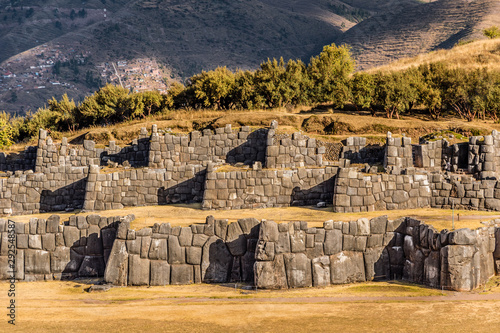 Walls of Sacsayhuaman archeological site at sunset, Cusco, Peru photo