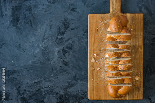 Jewish challah bread, sliced on black background, top view or flat lay 