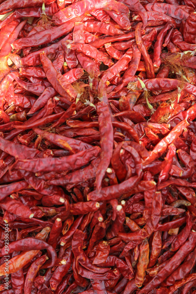 Top view of organic raw dried chillis ready for sale in the market. Top view of organic raw dried chillis ready for sale in the market.