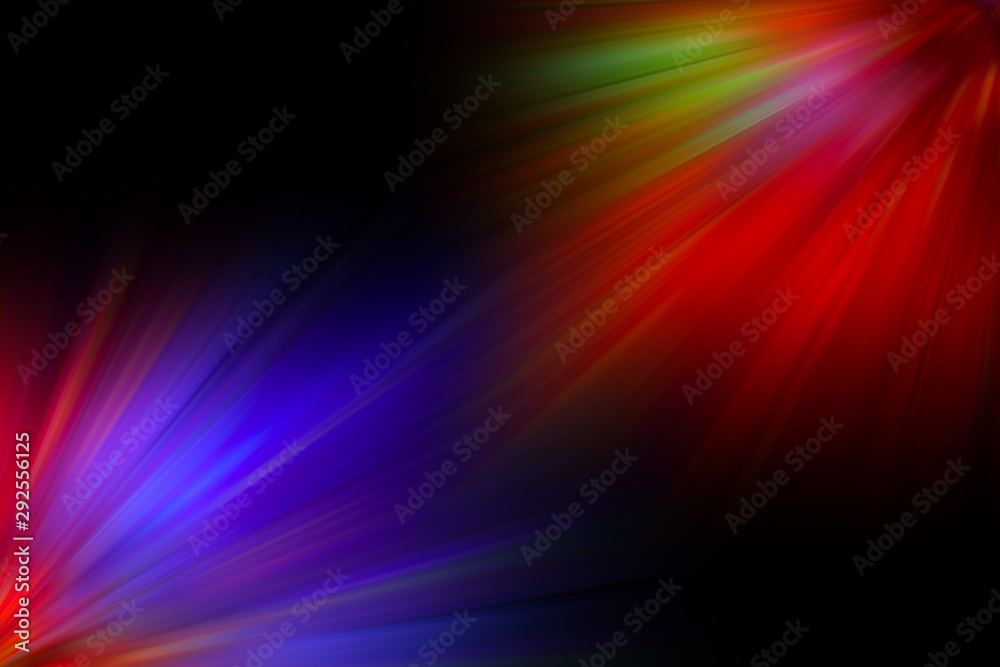 Multicolored rays of light shine of the black background Multicolored rays of light shine of the black background