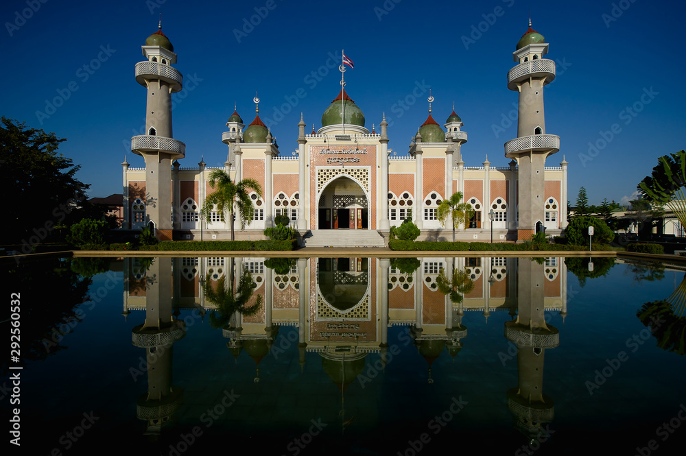 Beautiful central mosque and reflection in water at Pattani Central Mosque Thailand.(Translate Thai and Arab text in the picture is the name of The central mosque of Pattani Province)