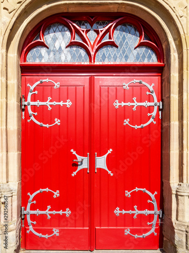 Mariawald Trappist Abbey beautiful sunlit red church door, close view, District of Dueren, North Rhine-Westphalia, Germany photo
