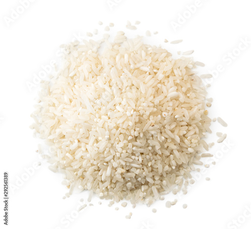Pile of rice groats on a white background. The view of the top.