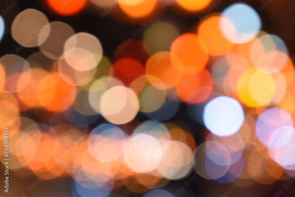 Fototapeta premium Bokeh light of orange, red, blue, coourful light for abstract background