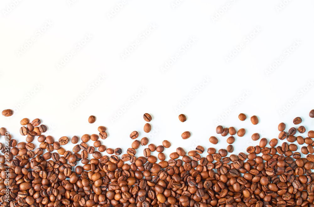 Naklejka premium Roasted coffee beans isolated on white background with space for your text