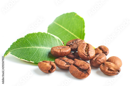 Coffee beans and leaves isolated on white background, closeup.