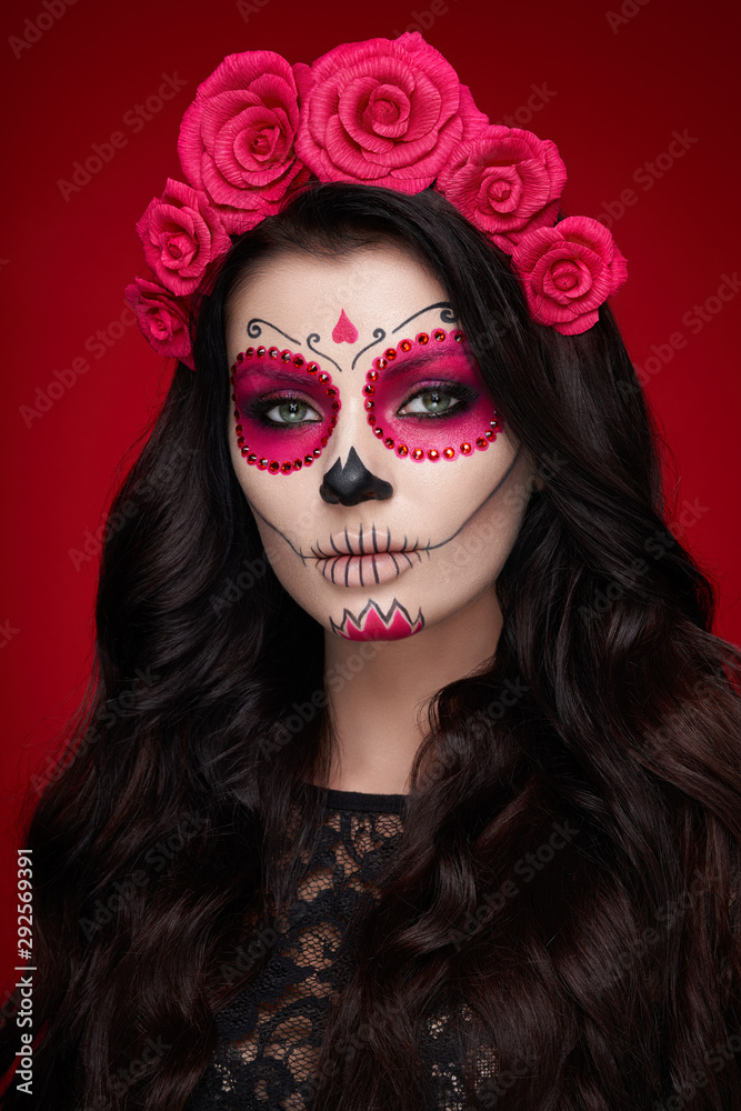Portrait of a woman with sugar skull makeup over red background. Halloween  costume and make-up. Portrait of Calavera Catrina Stock Photo | Adobe Stock