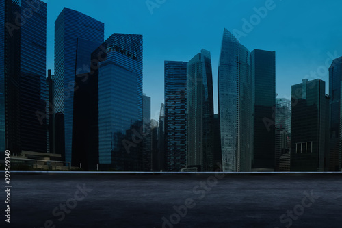 Singapore urban cityscape skyline night scene with empty loft cement floor on front.