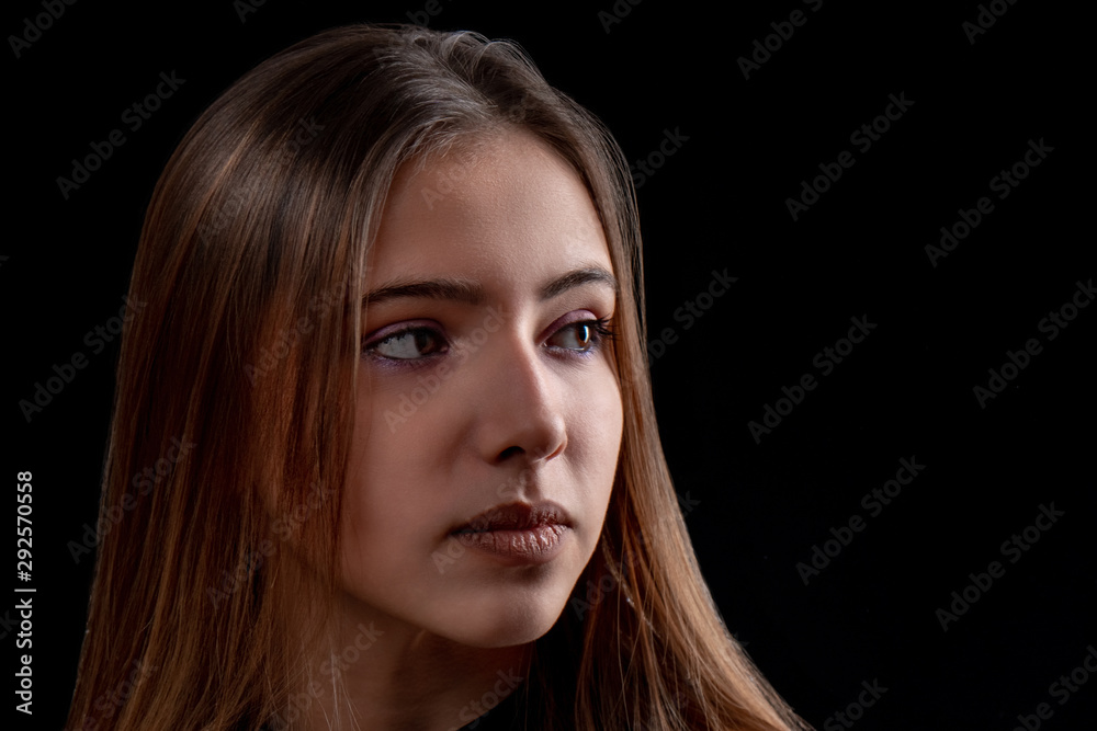 portrait of beautiful teenager girl on black background portrait of beautiful teenager girl on black background