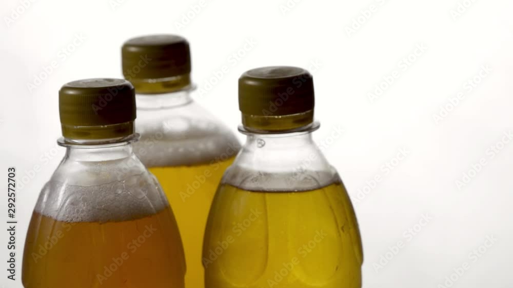 amber beer in three plastic bottles on a white background for Oktoberfest celebration amber beer in three plastic bottles on a white background for Oktoberfest celebration